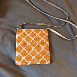 Orange and white beaded purse